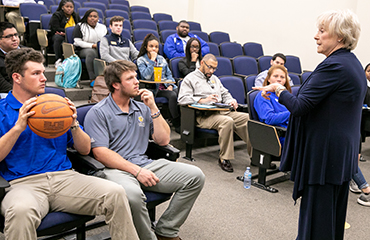Linda Dolny speaking to students