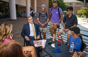 president with students